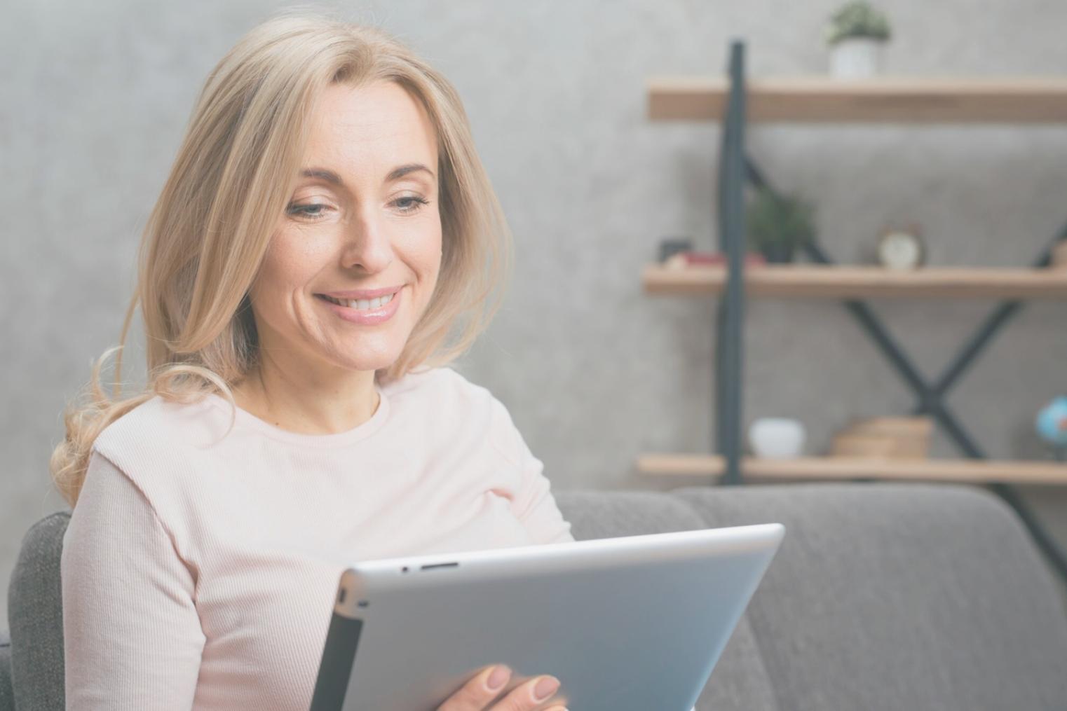 Students collaborating on mobile game architecture projects in modern learning environment